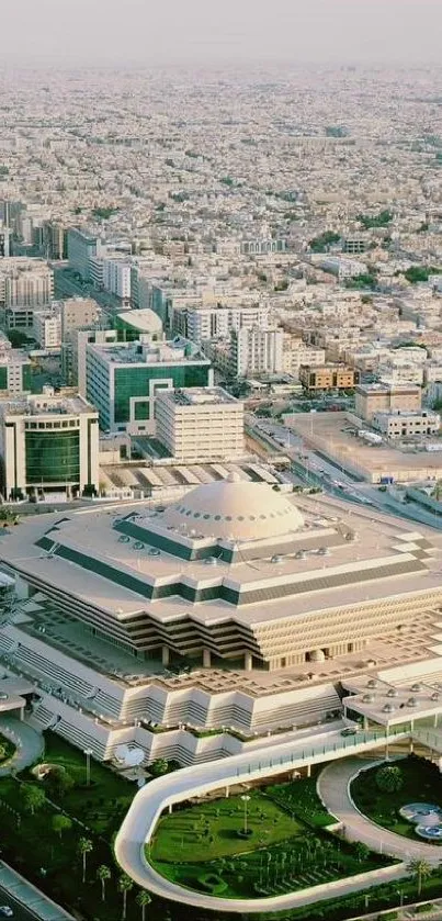 Aerial view of a modern cityscape with a distinctive architectural building.