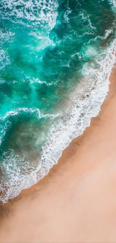 Aerial view of turquoise ocean waves and sandy beach, perfect for a serene wallpaper.