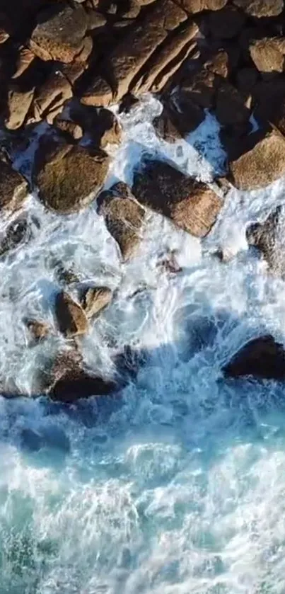 Aerial view of ocean waves on a rocky shore for mobile wallpaper.