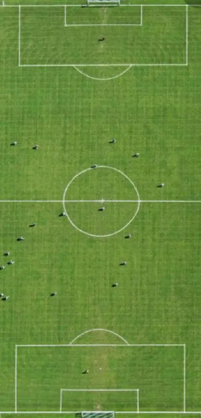 Aerial view of a soccer field with players engaging in a game.