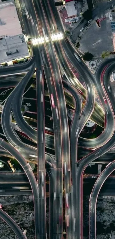 Aerial view of urban highway interchange with intricate road patterns.