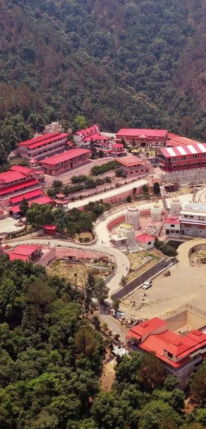 Aerial view of a colorful village with lush greenery and unique architecture.