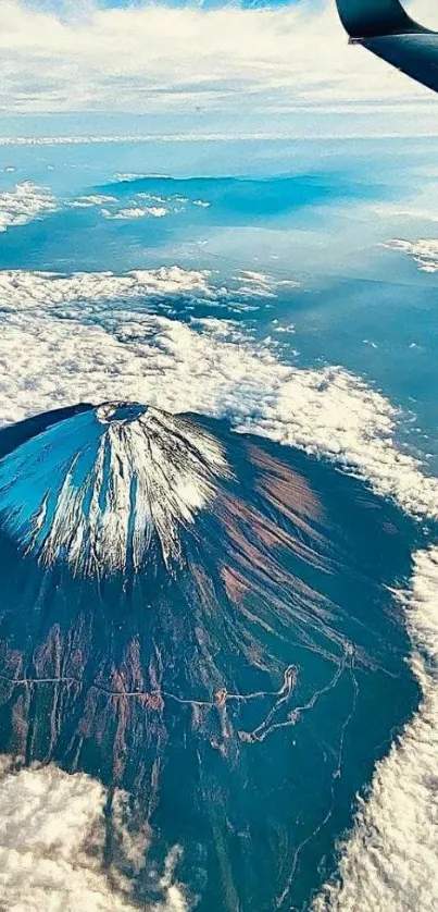 A breathtaking view of a volcano from an airplane window.