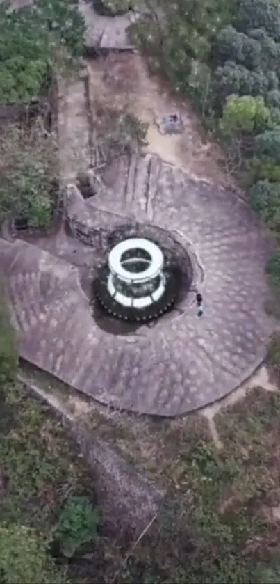 Aerial view of a spiral monument surrounded by lush greenery.