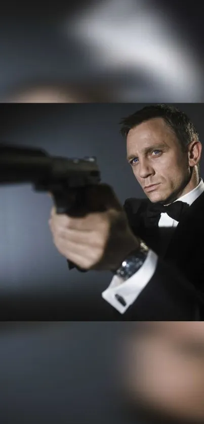 Tuxedo-clad agent aiming a pistol in a stylish mobile wallpaper.