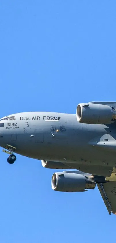 U.S. Air Force jet flying in a clear blue sky, captured for mobile wallpaper.