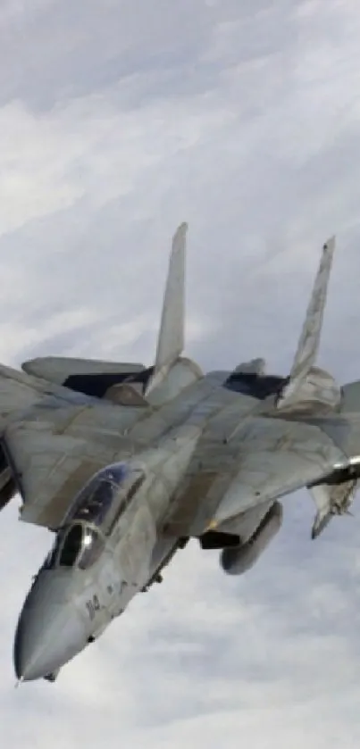 Two fighter jets soaring through cloudy sky.