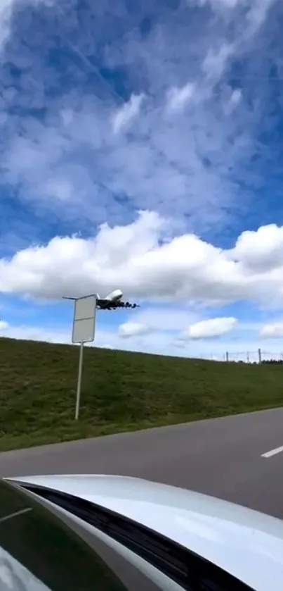 Airplane flying in a vibrant blue sky with fluffy white clouds.