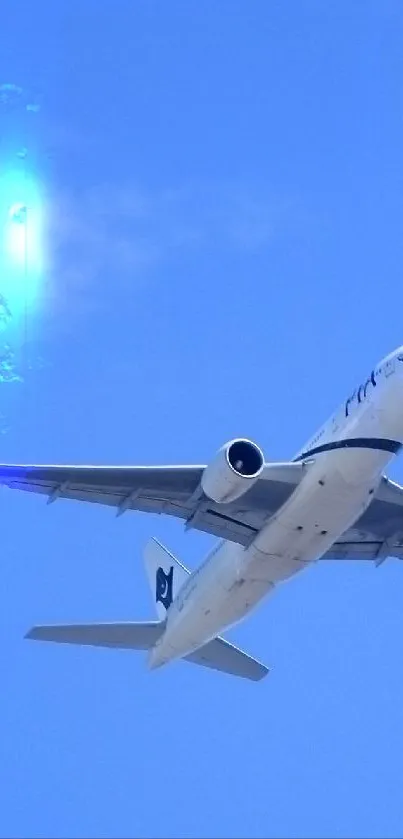 Airplane flying high in a clear blue sky, capturing a peaceful travel moment.