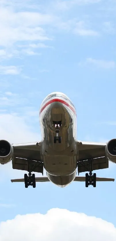 Flying airplane against a blue sky with scattered clouds.