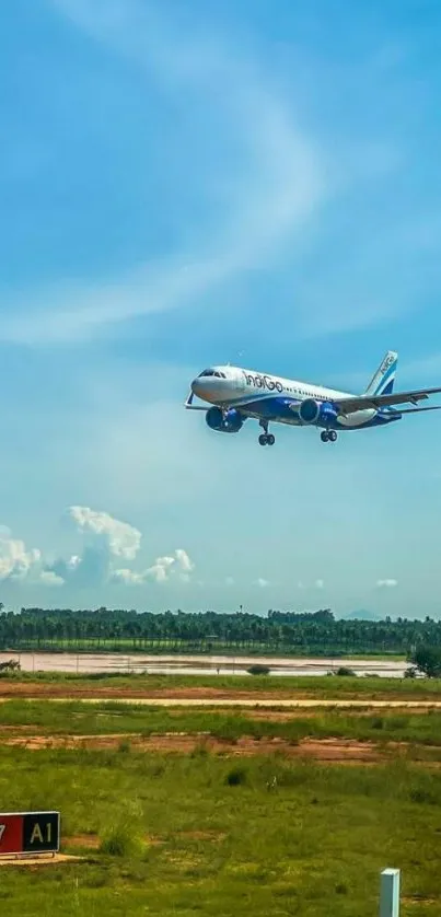 Airplane landing on a runway under a clear blue sky.