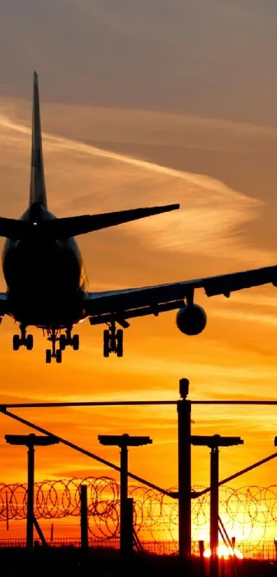 Airplane silhouette against an orange sunset, perfect for mobile wallpaper.