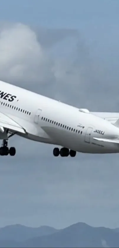 Airplane taking off into a cloudy sky.