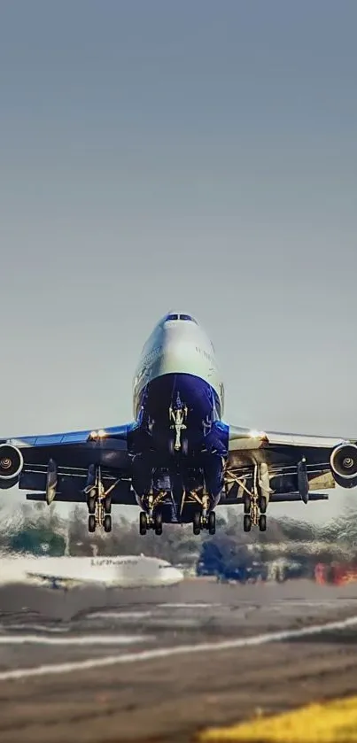 Airplane taking off from a runway with a clear sky backdrop.