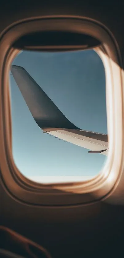 A serene view of the sky and airplane wing through a window, perfect for travel lovers.