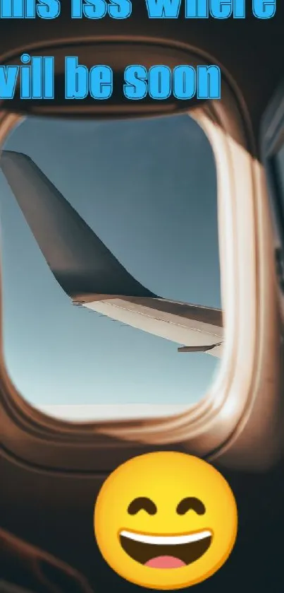 View of airplane wing from window with clear sky and emoji.