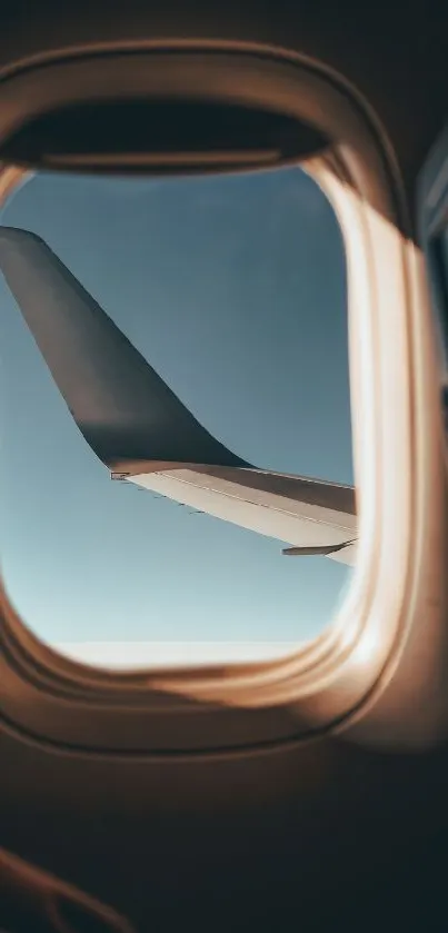 Scenic view of an airplane wing through a window on a sunny day.