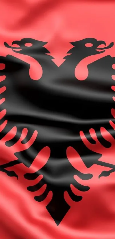 Albanian flag wallpaper with double-headed eagle on red silk texture.