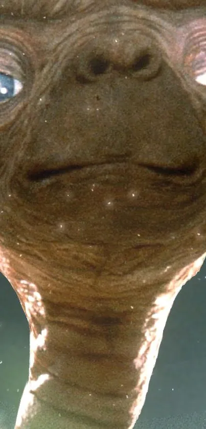 Close-up of a classic alien creature in a mobile wallpaper.