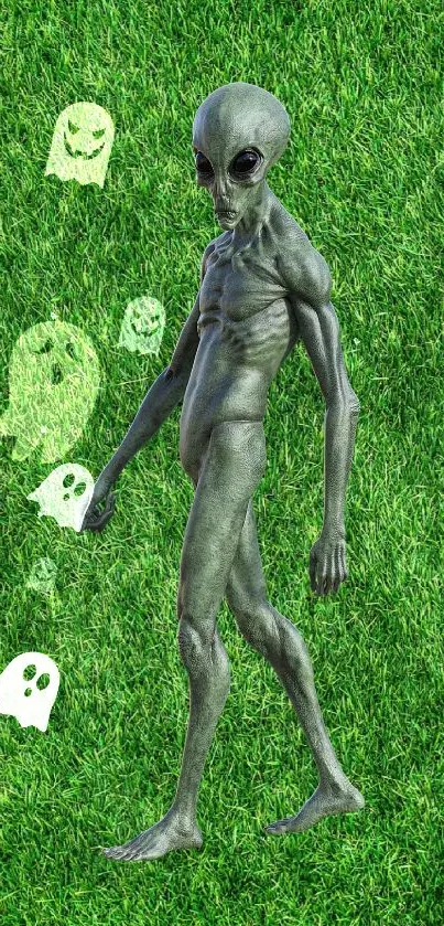 Alien with ghosts on grass background wallpaper.