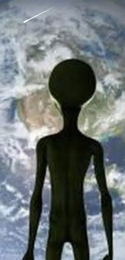 Alien silhouette against Earth in space wallpaper.