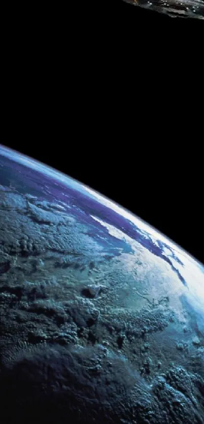 Alien spaceship hovering above Earth seen from space, under a black sky.