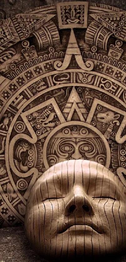 Intricately carved Aztec mask and calendar design in brown tones.