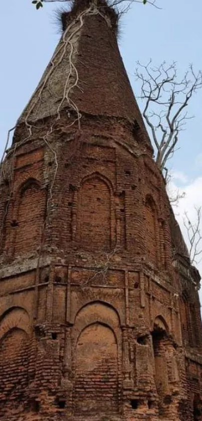 Ancient brick tower with sky background for mobile wallpaper.