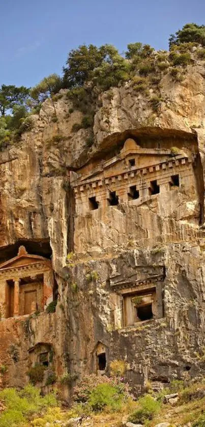 Ancient tombs carved into a rocky cliff.