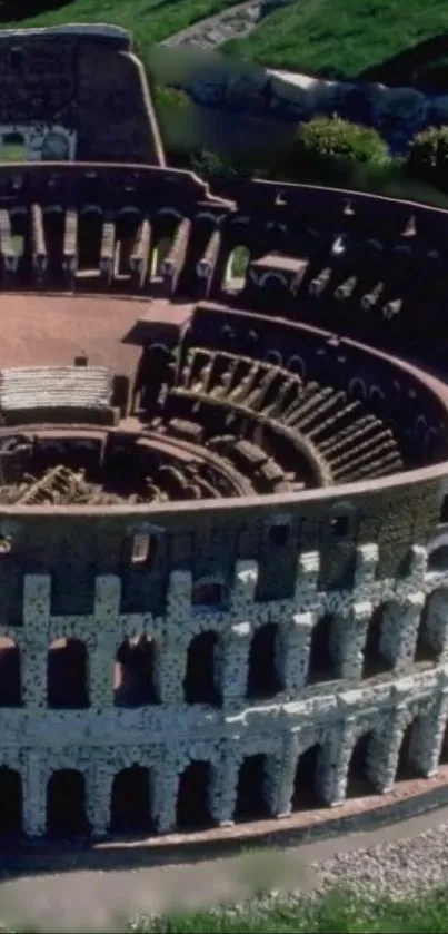 Aerial view of the ancient Colosseum in Rome with lush greenery surrounding.