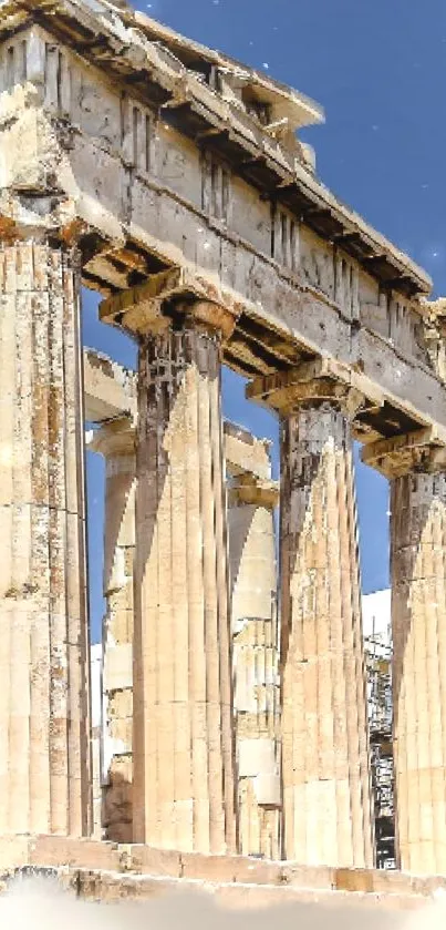 Ancient Greek temple with columns and a clear blue sky background.