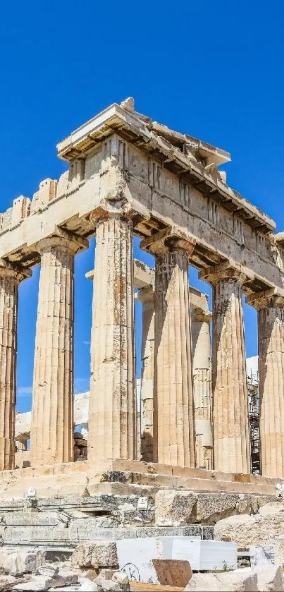 The Parthenon under a bright blue sky with ancient stone columns in Athens, Greece.