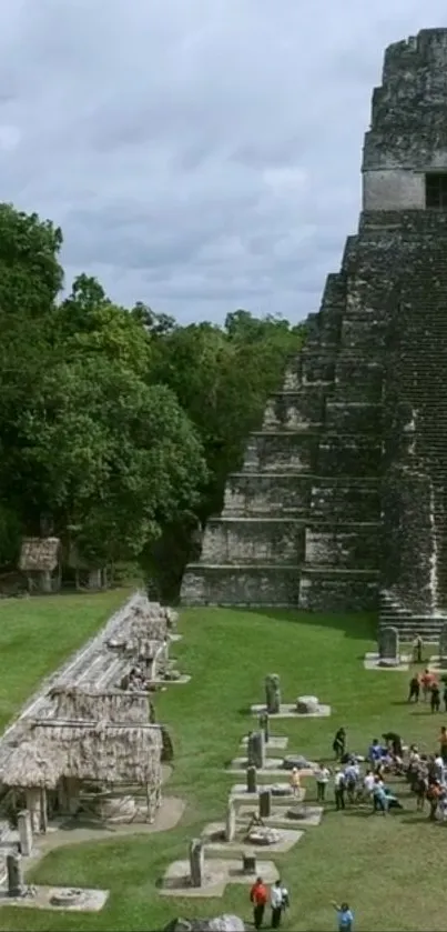 Ancient pyramid with surrounding greenery.