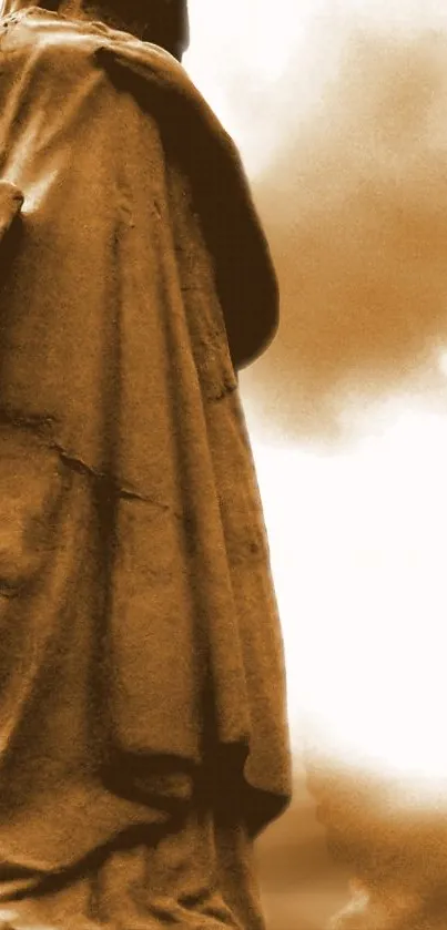 Sepia-toned ancient statue silhouette on cloudy backdrop.