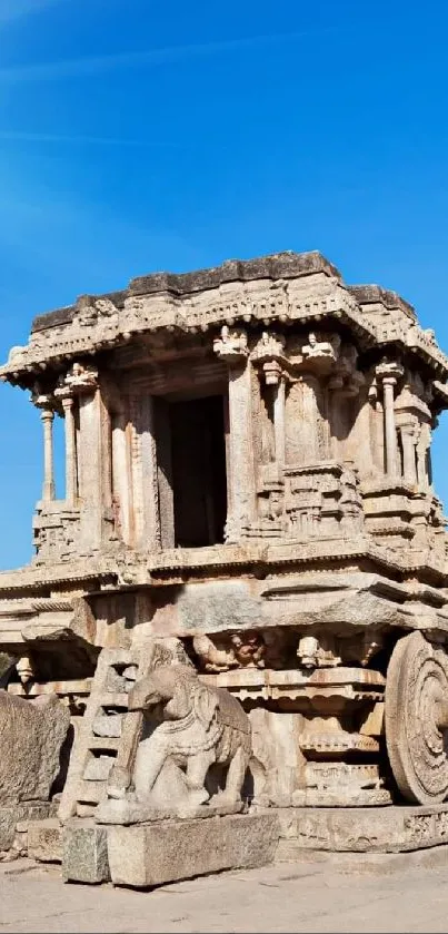 Ancient stone chariot under a blue sky with stunning detail.