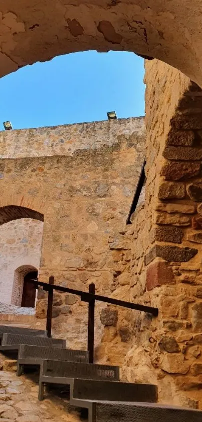 Ancient stone steps leading through a rustic archway.