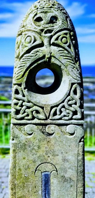 Intricate stone carving with blue sky backdrop.