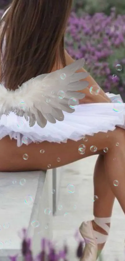 Ballet dancer with angel wings and lavender fields background.