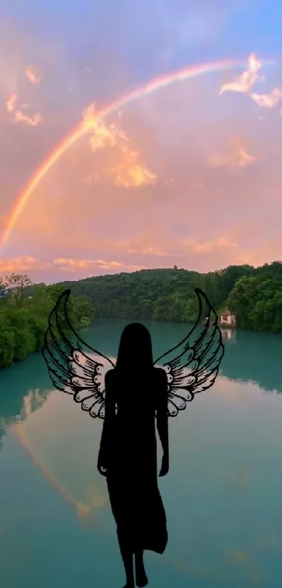 Angel silhouette with a rainbow over a serene lake.