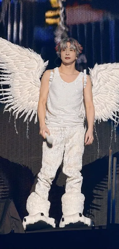 Person in an angelic white costume with wings.