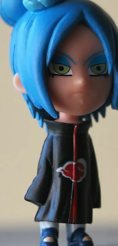 Anime figurine with blue hair and black outfit.