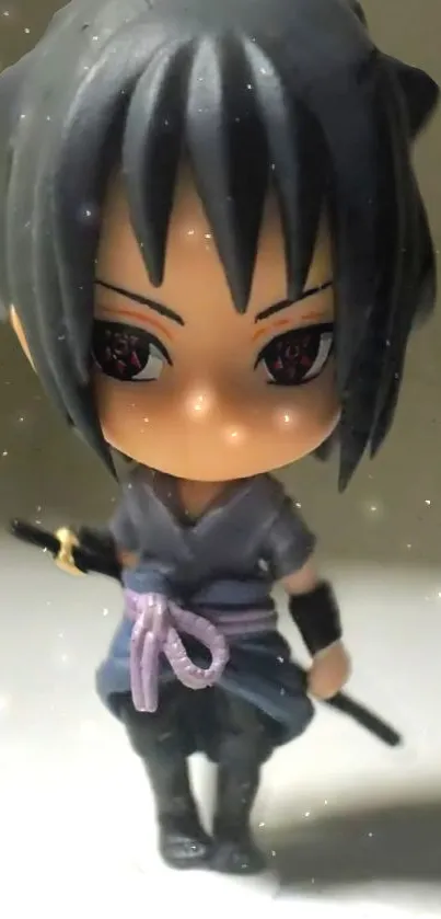 Chibi anime figure with sword on mobile wallpaper.