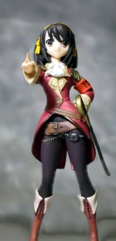 Anime character figure in red outfit on gray background.