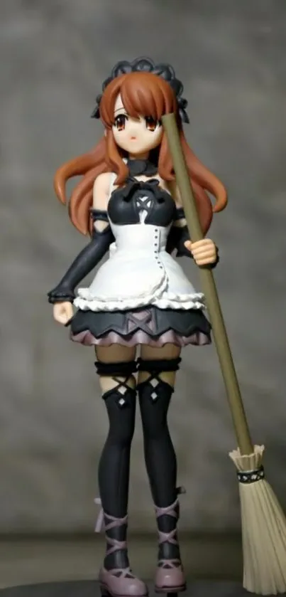 Anime figure maid with broom on gray background.