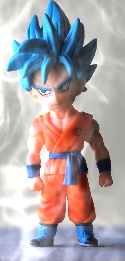 Anime figurine with blue hair and orange outfit on a neutral background.