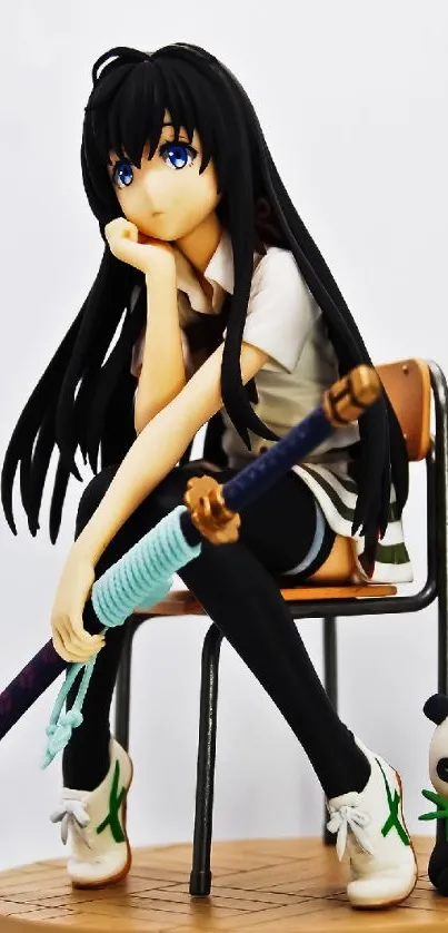 Anime character figurine with katana and panda on a chair.