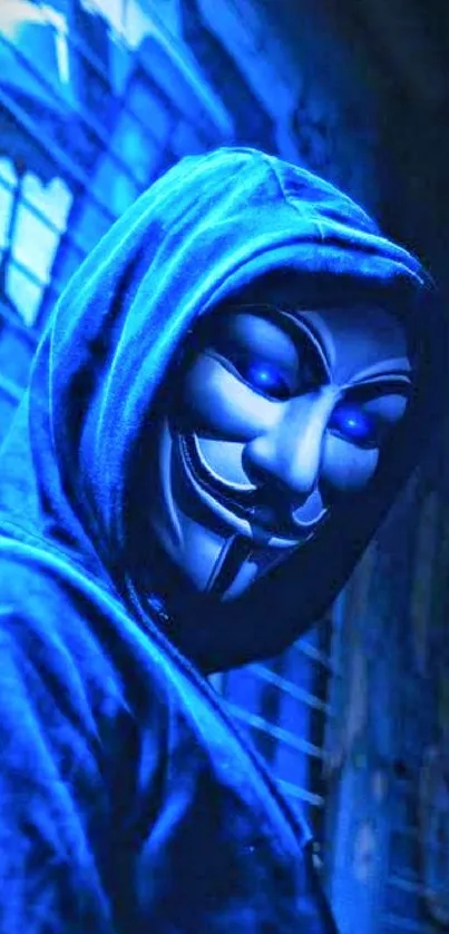 Anonymous mask glowing blue in a dark setting with a hoodie.