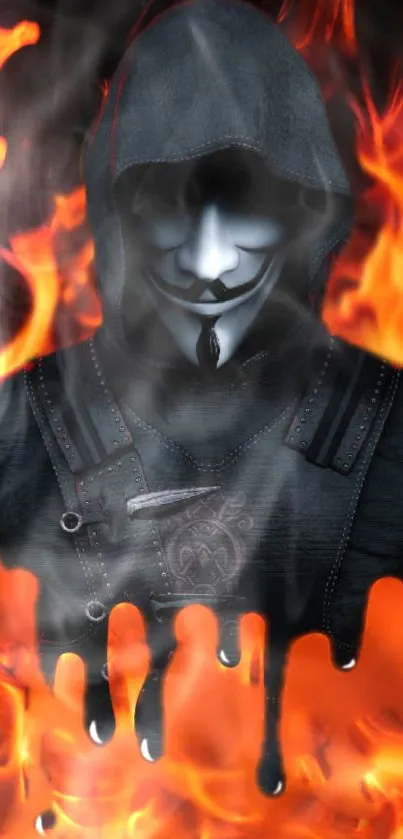 Anonymous mask in flames with smoke and a dark hooded figure.