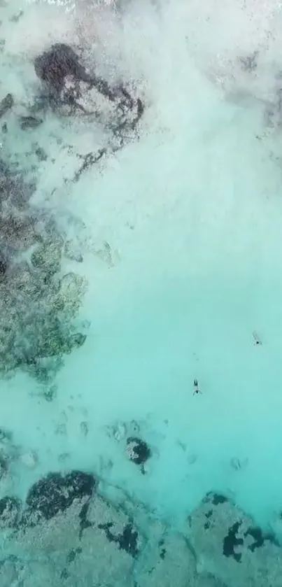 Aerial view of an aqua beach with gentle waves and serene ambiance.