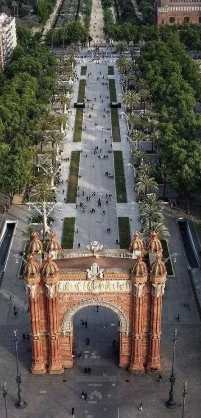 Aerial view of Barcelona's Arc de Triomf and surrounding green pathways.